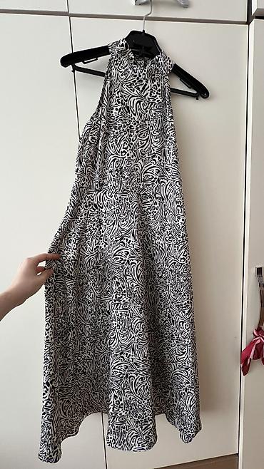 Ziyafət donları: - Məhsul: Oversize T‑shirt - Brend/Qrafika: “NEW ERA” mövzulu çap; ön — 11