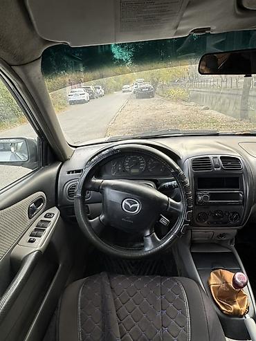rexton j4: Mazda Familia: 2002 г., 1.6 л, Механика, Бензин, Хэтчбэк — 4