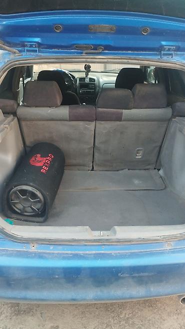 маркер для авто: Mazda Familia: 2003 г., Механика, Универсал — 4