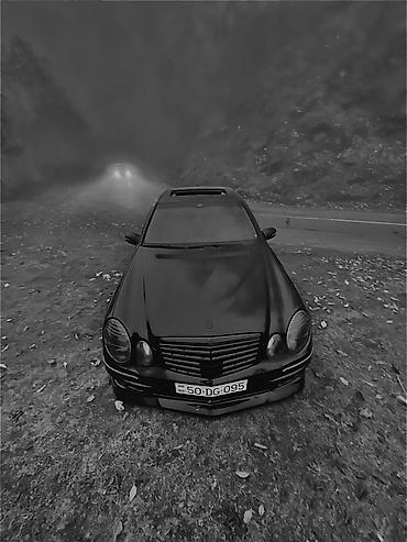mercedes sekilleri: Mercedes-Benz E‑Class (W211) sedan – qara rəng, AMG üslublu eksteryer — 1