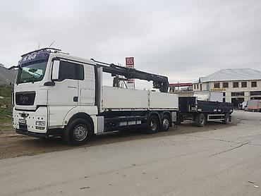 tatra 815: Yükdaşıma xidməti – bortlu kranmaşın və qoşqu - Avtomobil: MAN TGA — 1
