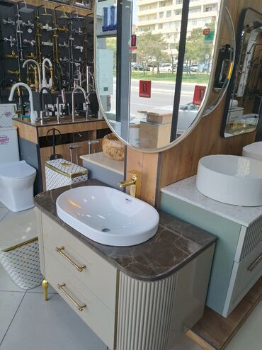 moydalar: Oval formalı ağ rəngli keramika lavabo, tünd mərmər naxışlı səthə