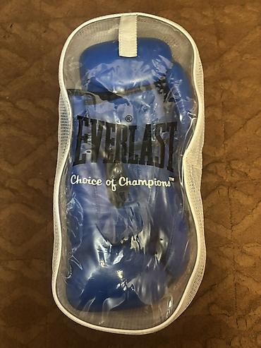 Перчатки: Боксерские перчатки Everlast, синий цвет. - Вес/размер: 12 oz — 1