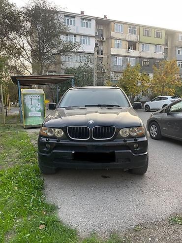 tesla model x: BMW X5 (E53) – qara rəngli, tam ölçülü premium SUV. Texniki və dizayn — 1