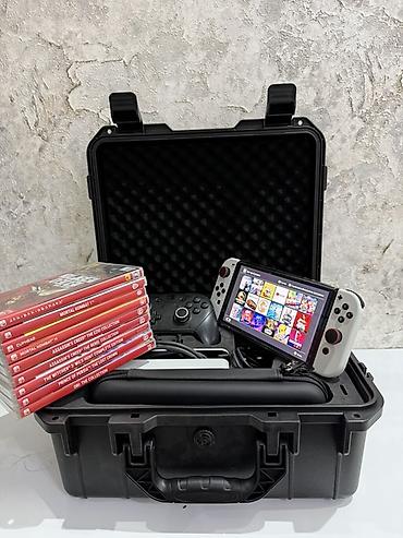 nintendo advance sp: Портативный игровой комплект Nintendo Switch OLED в защищённом кейсе — 1