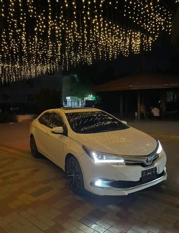 авто афтамат: Toyota Corolla: 2019 г., 1.8 л, Типтроник, Гибрид, Седан