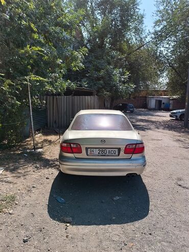 колесо на камри: Mazda Capella/626, седан, серебристый цвет. Киргизские номера (04 KG