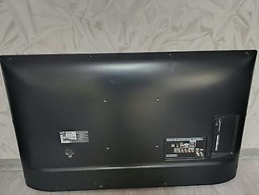 tv stick: LG LED televizor, təxminən 42–47 düym ekran ölçüsü. Nazik gümüş — 5