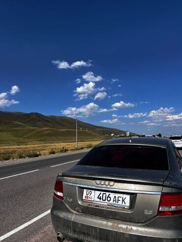 айнек бишкек: Седан Audi A6 в сером цвете. Автомобиль имеет характерный дизайн с