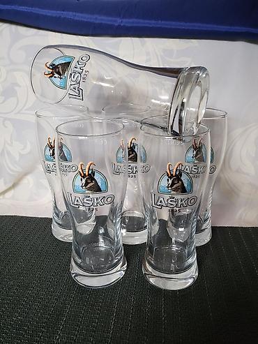 Čaše: Case nove za Lasko pivo. Nove case za pivo sve na njima odsjaj od — 6