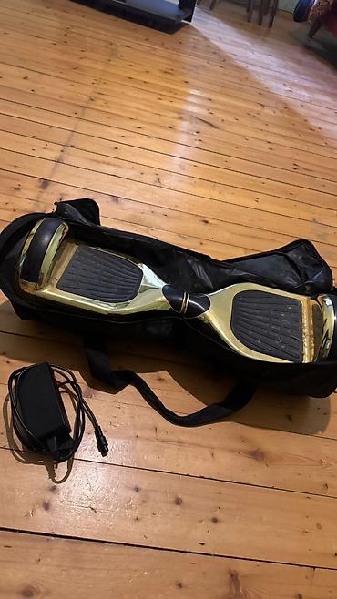 Giroskuterlər: Qızılı rəngdə iki təkərli hoverboard (self-balance skuter) — 3