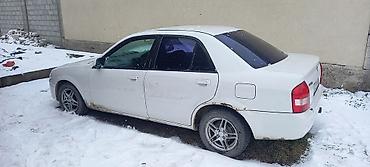 sr group: Mazda Familia: 1999 г., 1.5 л, Автомат, Бензин, Седан — 6