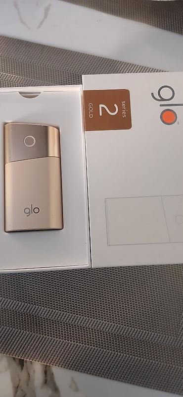 qızıl sirqa: Glo Series 2 – Gold rəngli tütün çubuğu qızdırma cihazı - Model: glo — 1
