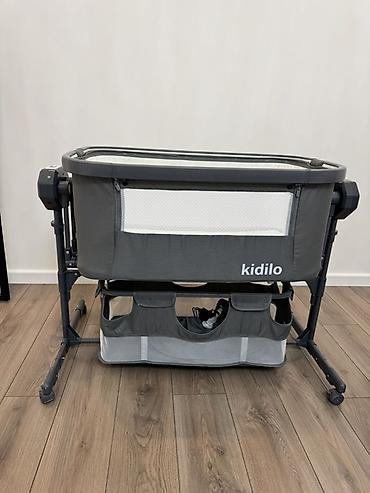 Детская мебель: Детская прикроватная колыбель Kidilo с авто качалкой и колыбельной — 1