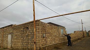 Satılır: daş hasarla əhatələnmiş torpaq sahəsi və həyət evi - Qalın