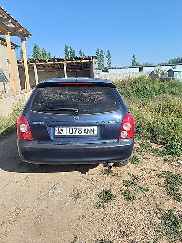 прокладка впускного коллектора: Mazda 323: 2001 г., 1.6 л, Механика, Бензин, Универсал — 2