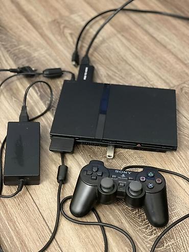 xbox konsolu: Sony PlayStation 2 Slim (SCPH seriyası) oyun konsolu Paket tərkibi: - — 2