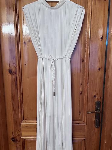 Ağ rəngli pliseli maxi don - Zərif, düz kəsimli, yüngül axışlı parça lalafo.az -da Ağ rəngli pliseli maxi don - Zərif, düz kəsimli, yüngül axışlı parça