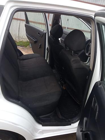 Chevrolet: , ağ rəng, 5 qapılı hetçbek. Xüsusiyyətlər: - Sürət qutusu: mexaniki — 4