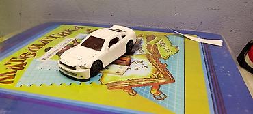 игрушечная машина на которой можно ездить: Игрушечная машинка в виде спортивного купе. Корпус выполнен в белом — 1