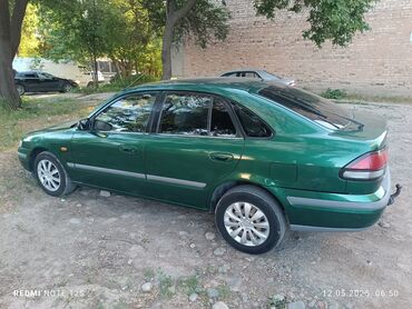 Mazda: Mazda Capella: 1998 г., 1.8 л, Механика, Бензин, Хэтчбэк