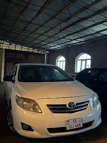 toyota aygo: Toyota Corolla (E140), ağ rəng, sedan gövdə. Xarici: - Orijinal — 2