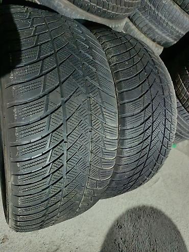 зимний балон: Шины 285 / 45 / R 21, Зима, Б/у, Пара, Легковые, Bridgestone — 1