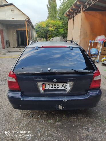 нисан сефро ошто: Седан Nissan Cefiro синего цвета. Модель обладает хактерными передними