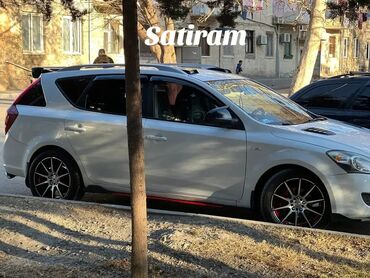 Kia: Kia Cee’d SW, ağ rəng, universaldır. Şəhər və uzun yol üçün praktik və — 4
