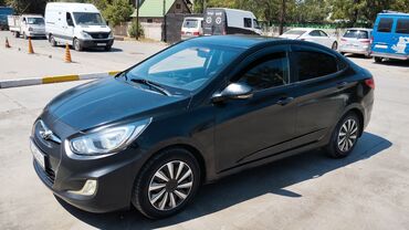 матор на рекстон: Черный седан Hyundai Accent с элегантным дизайном, черными литыми