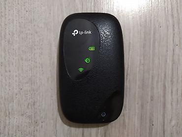 Модемы и сетевое оборудование: TP-Link M7000 4G. Универсальный карманный Wi-Fi роутер. Работает с — 1