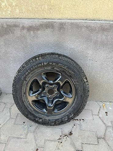 70: Колесо в сборе: шина + стальной диск R16. - Размер шины: 215/70 R16 — 1