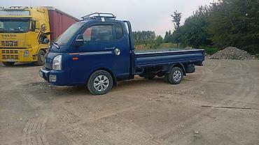 тесла модел с: Hyundai Porter II — компактный бортовой грузовик синего цвета — 2
