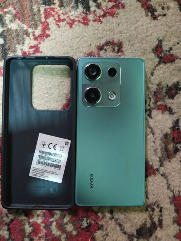 duyu bişirən: Redmi smartfon və orijinal Redmi qoruyucu keys. Telefon Kirdet di amma