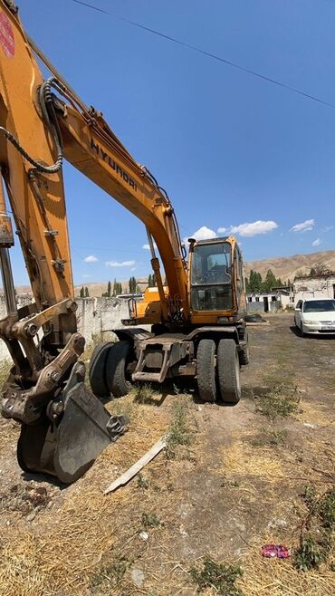 дельфин маршрутка: Экскаватор, Hyundai, 2003 г., Колесный