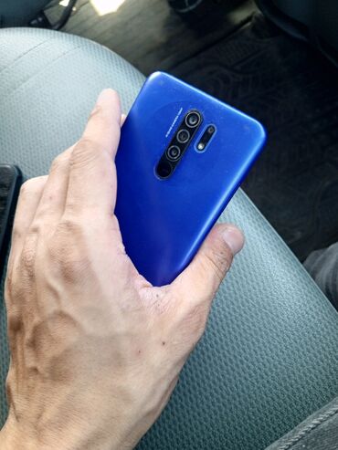 телефон fly mc220: Xiaomi Redmi 9, 64 ГБ, цвет - Синий, 
 Сенсорный, Отпечаток пальца, Две SIM карты