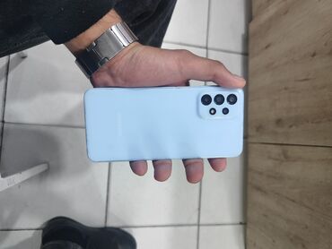 флай тонкий телефон: Samsung Galaxy A23, 64 ГБ, цвет - Синий, Кнопочный, Отпечаток пальца, Face ID