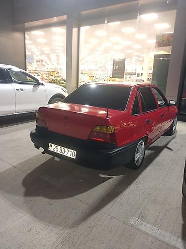 daewoo nexia 2005: Qırmızı rəngli Daewoo Nexia sedan. Avtomobil 4 qapılı kuzova — 6