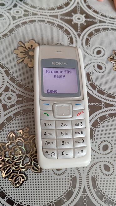 telefon tutacagı: Nokia 1, rəng - Ağ, Düyməli, Sənədlərlə