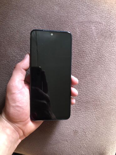 şok çəkən: Xiaomi Redmi smartfon - Model: Redmi (arxa hissədə “Redmi” loqosu) -