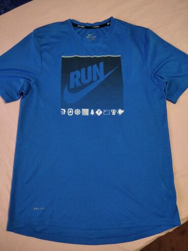 pantalone s krem boja hirch: Nike sportska majica vel S u super stanju.Plava boja