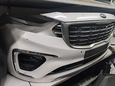 Kia Carnival В комплекте на фото: - передний бампер белого цвета; -