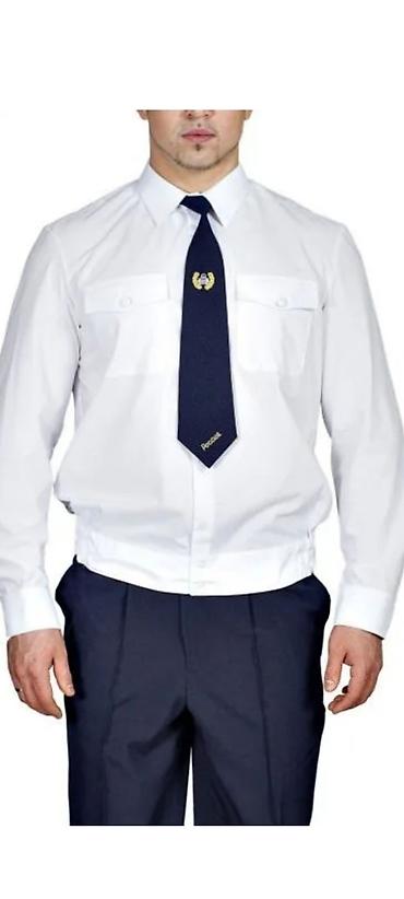 Рубашки: Белая форменная рубашка с длинным рукавом и накладными карманами с — 2