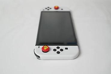Nintendo Switch: U ponudi je Nintendo Switch OLED (čipovan). Memorija: 256 GB + 64 GB — 12