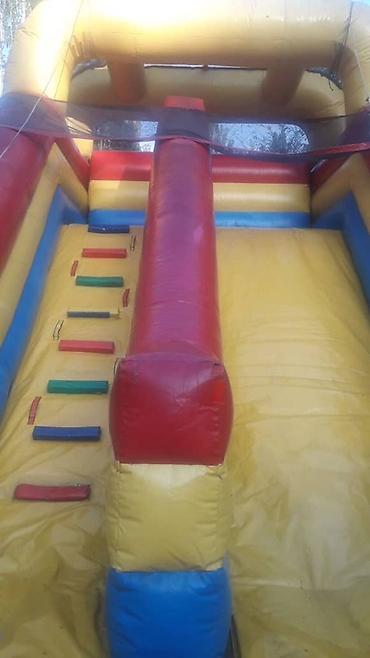 Детские аттракционы: Продаю или сдам в аренду батут - горка .размеры: высота - 4,5 м.длина — 8