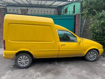 Ford: Желтый фургон Ford Courier, предназначенный для перевозки небольших