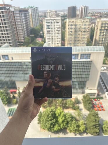 gta 5 diskinin qiymeti: PlayStation 4 üçün Resident Evil 3 oyun diski. Bu, klassik qorxu