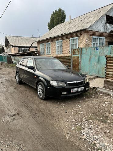 дверные карты одиссей: Mazda Familia: 1999 г., 1.6 л, Механика, Бензин, Хетчбек