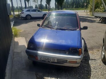 тико автомобиль: Автомобиль Daewoo Tico синего цвета с серыми элементами кузова