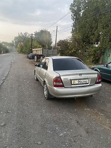 машина daihatsu: Mazda 323: 2001 г., 1.5 л, Автомат, Газ, Седан — 4